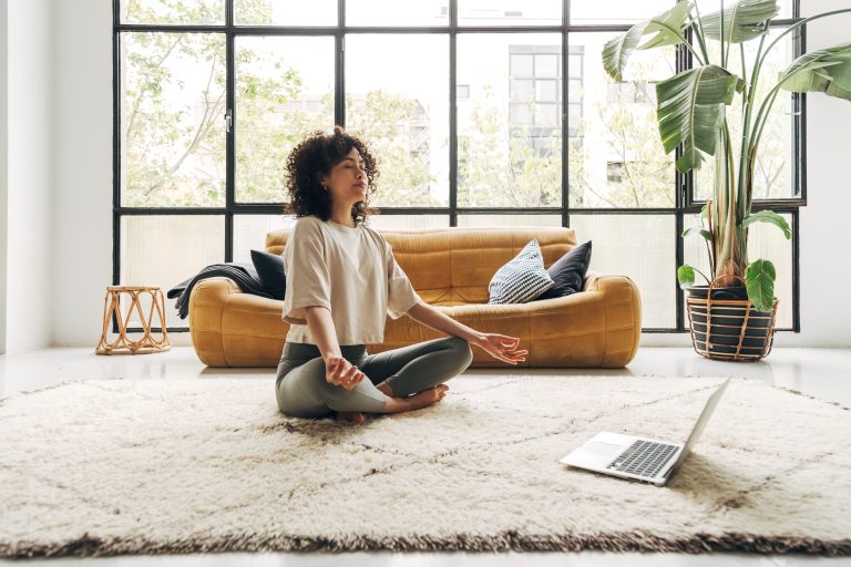 woman in desert oasis recovery meditating